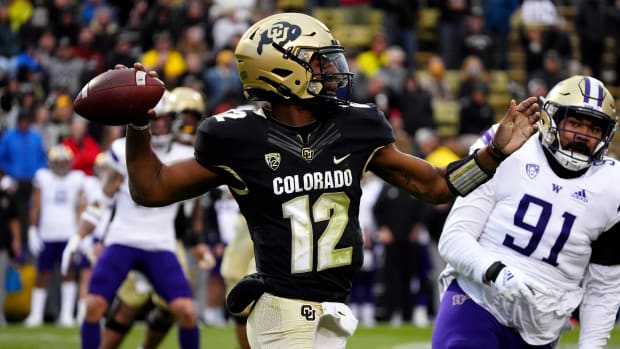Nov 20, 2021; Boulder, Colorado, USA; Colorado Buffaloes quarterback Brendon Lewis (12) prepares to pass in the third quarter against the Washington Huskies at Folsom Field. Mandatory Credit: Ron Chenoy-USA TODAY Sports